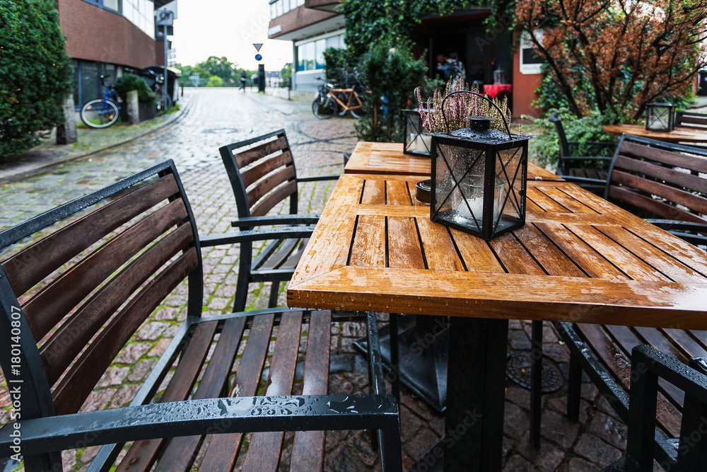 empty wooden wet table in outdoor cafe
