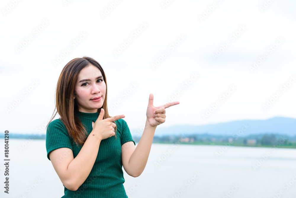Beautiful asian girl make hand for take photo outdoor Beautiful asian girl make hand for take photo outdoor