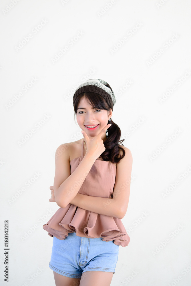Portrait of hipster girl on white wall,lifestyle of modern teen Portrait of hipster girl on white wall,lifestyle of modern teen