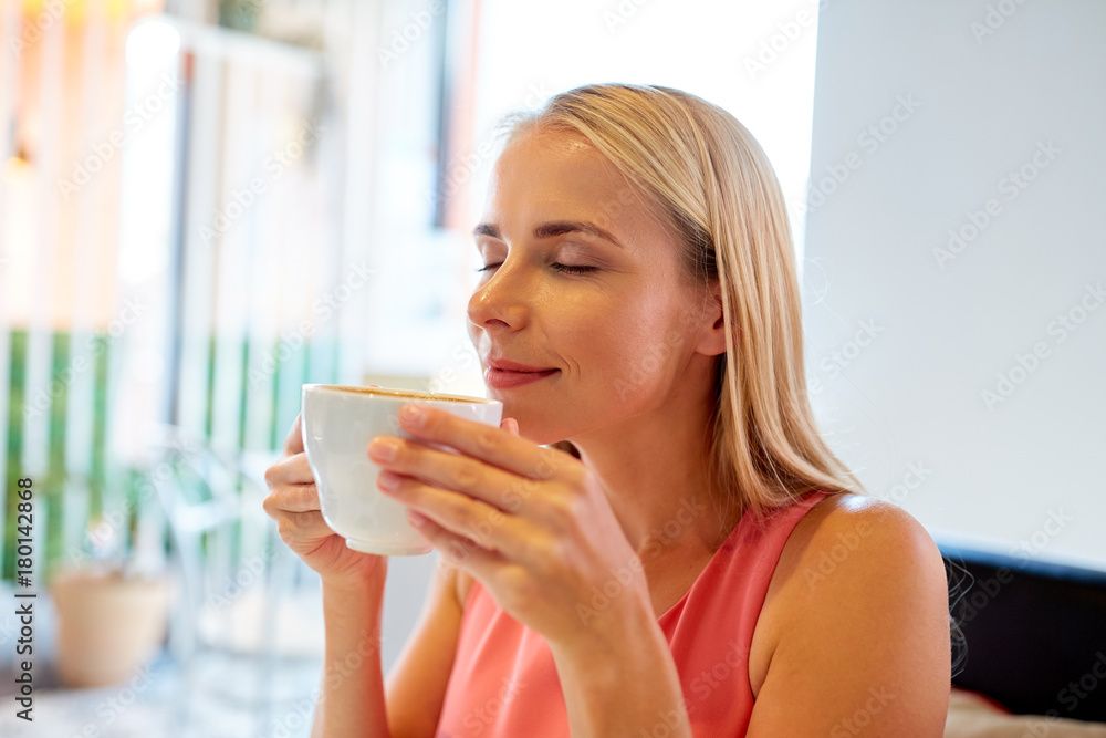 close up of woman drinking coffee at restaurant close up of woman drinking coffee at restaurant