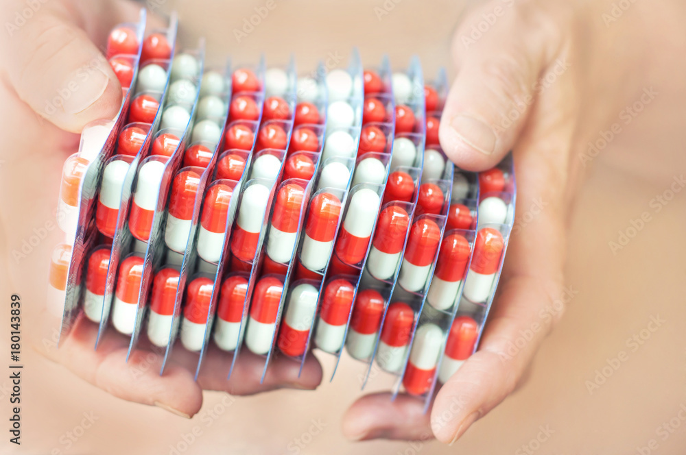 The hands of an elderly man with many pills The hands of an elderly man with many pills