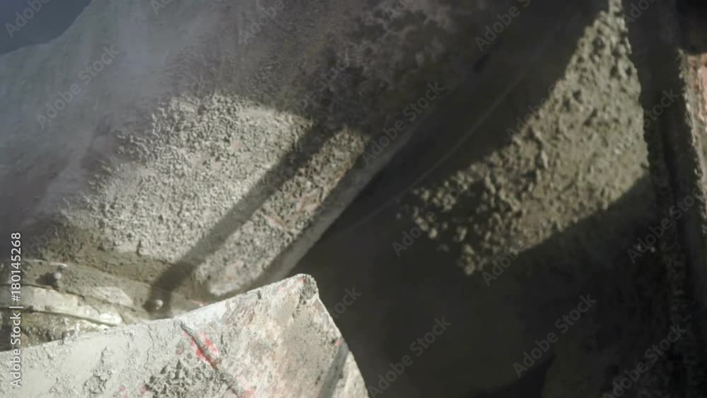 Concrete mixer turns on the truck close up Concrete mixer turns on the truck close up