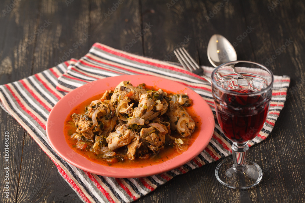 Chakhokhbili - chicken stewed with tomatoes and onions. Georgian national dish Chakhokhbili - chicken stewed with tomatoes and onions. Georgian national dish
