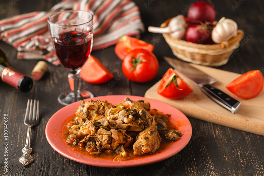 Chakhokhbili chicken stew with vegetables on the table. horizontal view from above