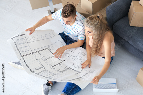 Young couple with house pla...