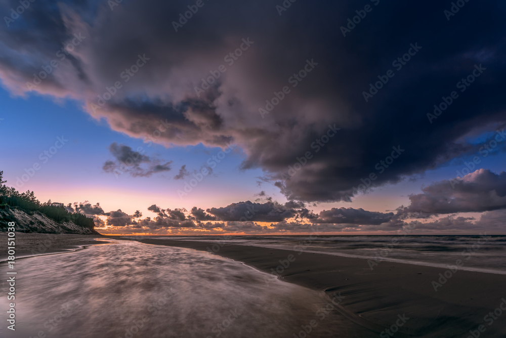 Magic and dramatic clouds over the Baltic Sea during a sunset