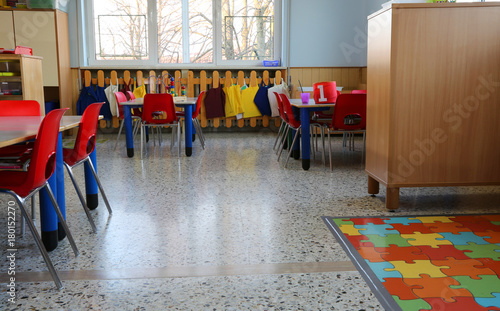 inside of a classroom in kindergarten with small chairs