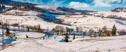 panorama of Carpathian village in winter. beautiful rural scenery in mountainous area