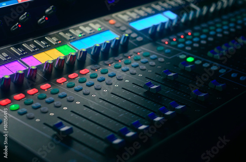 Board mixing console. Mixer. The sound engineer's console. Sound engineer's fingers are pressing the button audio controller.work place sound engineer's.