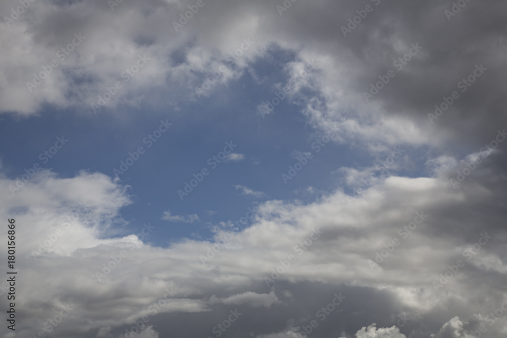 Isolated View of White Clouds Against  Blue, Sunlit Sky - Backdrop