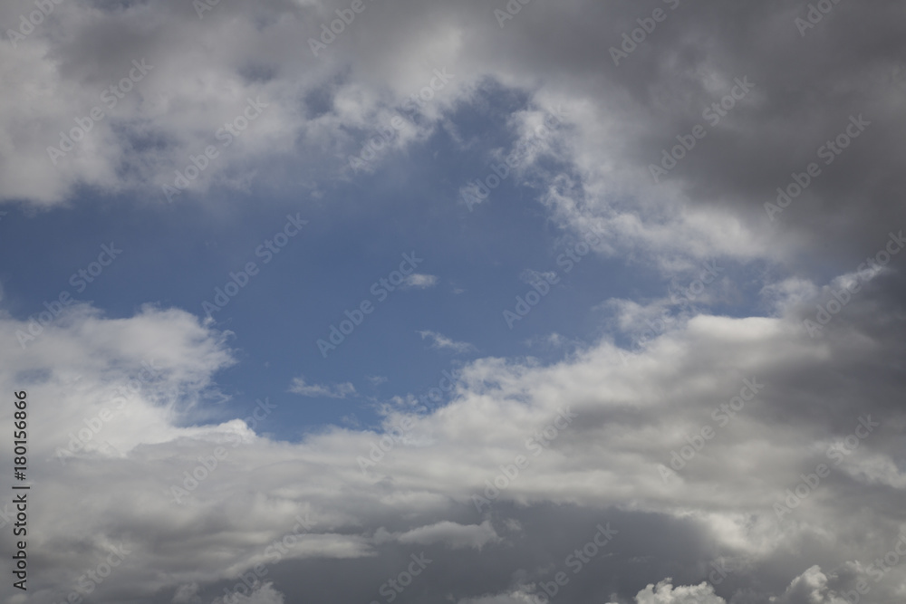Obraz premium Isolated View of White Clouds Against Blue, Sunlit Sky - Backdrop