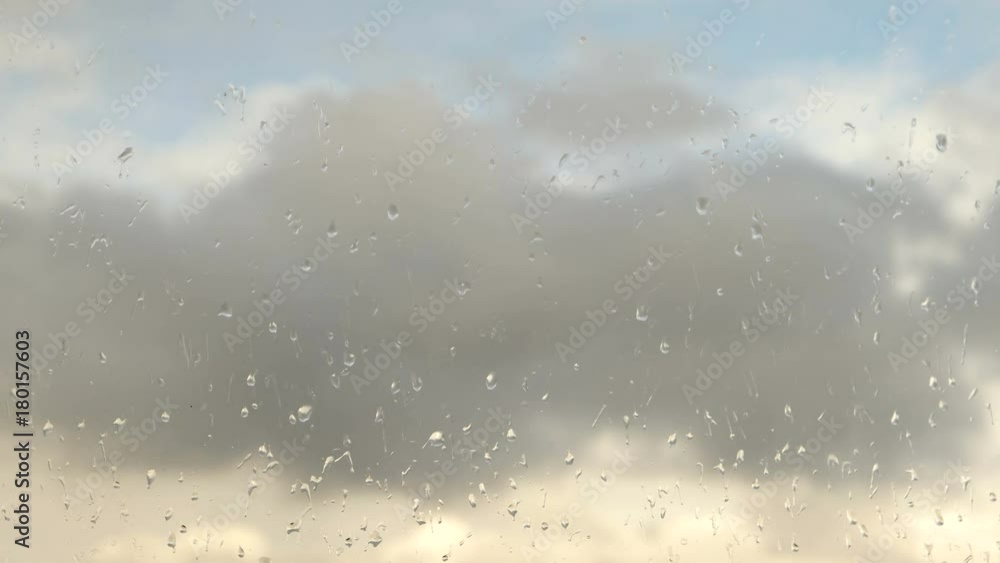 time lapse clouds, rain drops on glass time lapse clouds, rain drops on glass