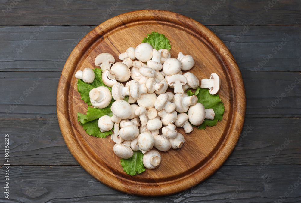 mushrooms with parsley on dark wooden background. top view mushrooms with parsley on dark wooden background. top view