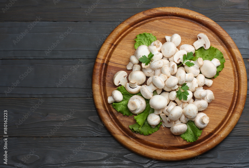 mushrooms with parsley on dark wooden background. top view mushrooms with parsley on dark wooden background. top view