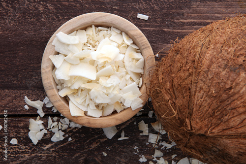 Coconut flakes with whole coconut. Tropical food concept.