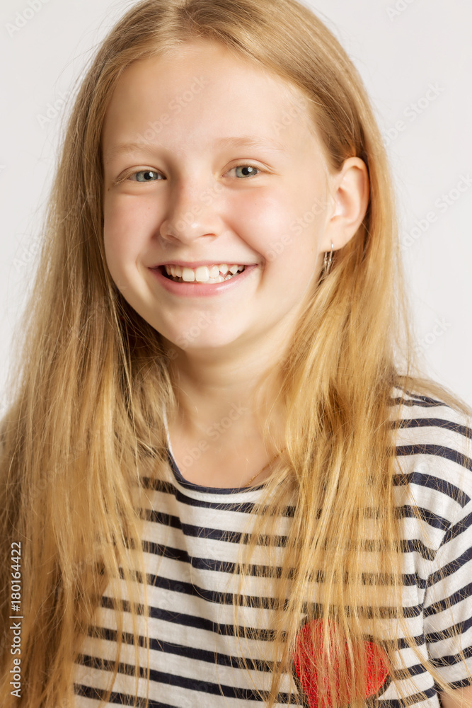 A girl with long red hair laughs A girl with long red hair laughs