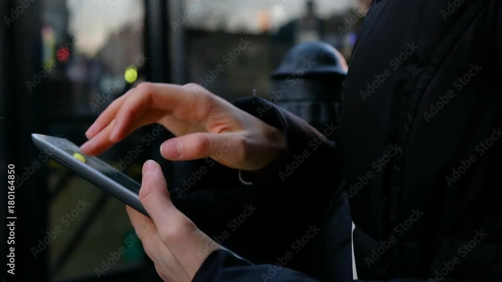 Close up on the hand of young woman using tablet - technology, social network, communication concept Close up on the hand of young woman using tablet - technology, social network, communication concept