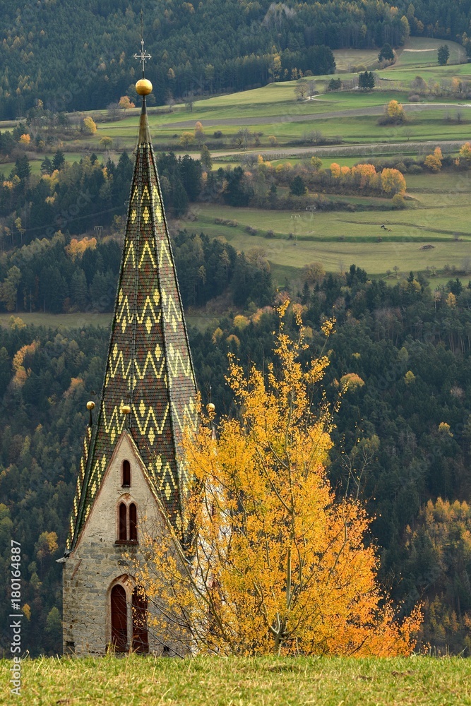 The Church of Villandro in Autumn season. Bolzano, Italy.