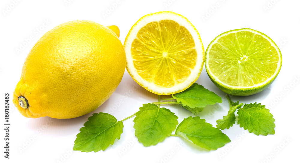 One whole lemon, lemon and lime halves with fresh lemon balm leaves isolated on white background. One whole lemon, lemon and lime halves with fresh lemon balm leaves isolated on white background.