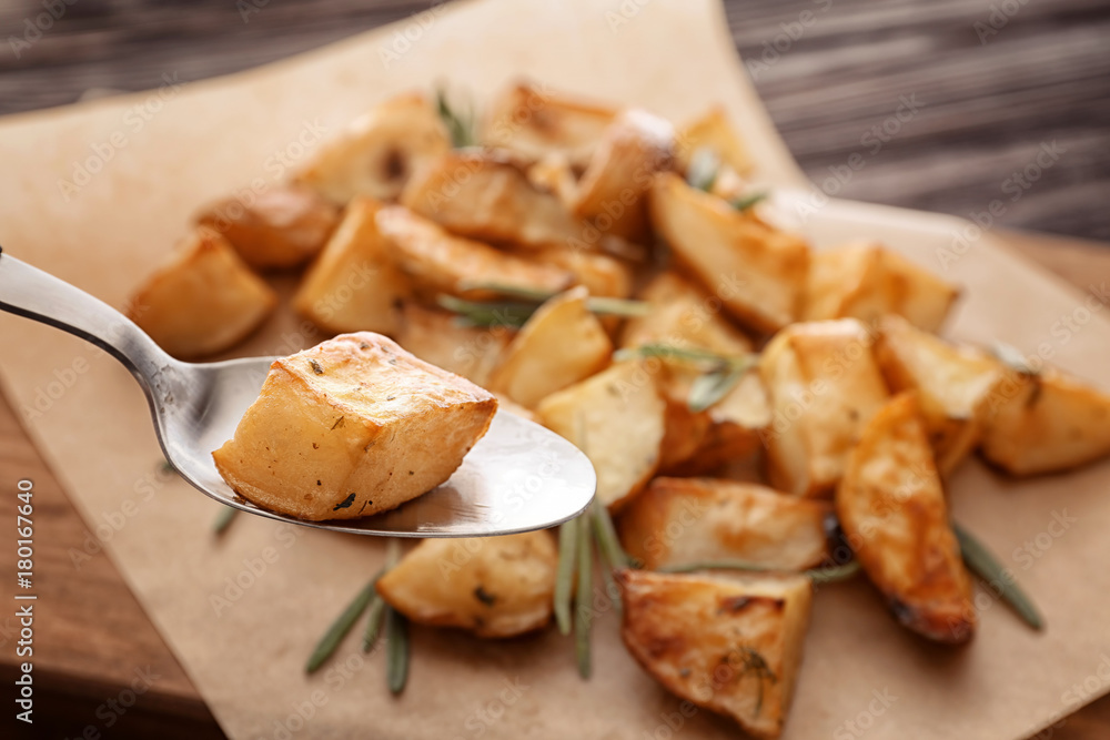 Spoon with potato piece, closeup Spoon with potato piece, closeup