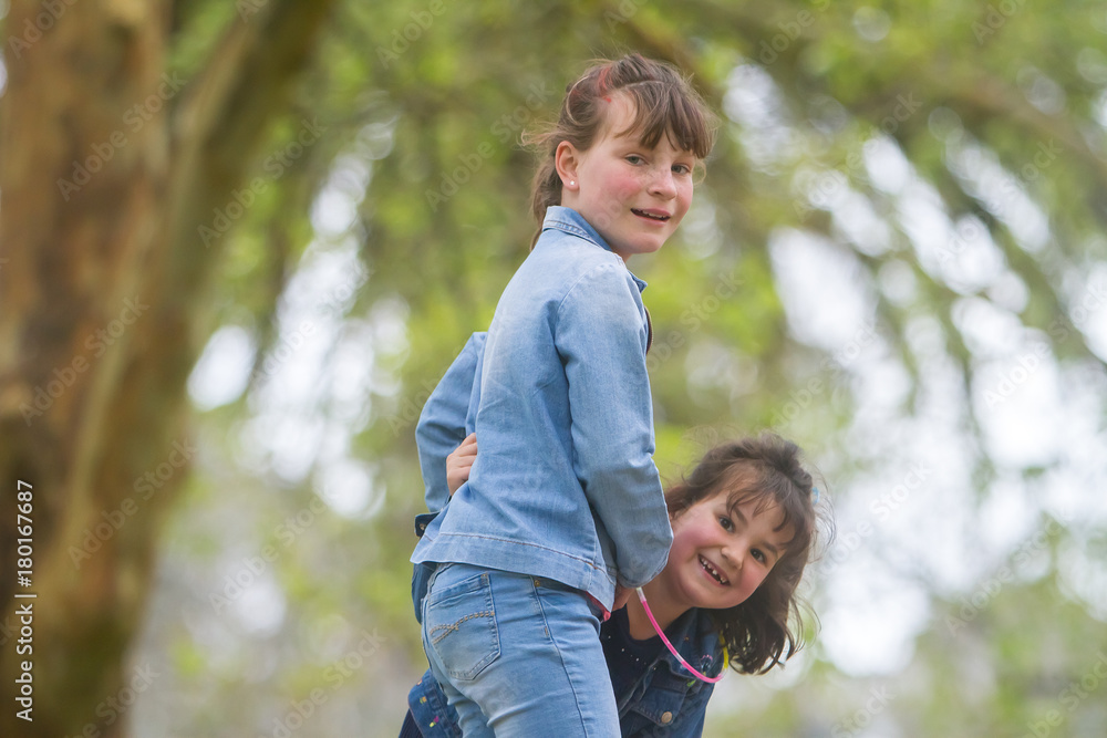 outdoor portrait of young happy girls having fun on playground outdoor portrait of young happy girls having fun on playground