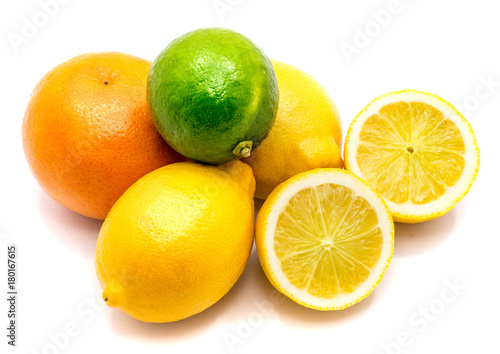Citrus. Two whole limes, lemons and its halves isolated on white background.