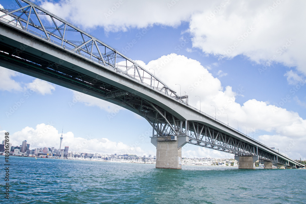 view of Auckland CBD, city center, with sky tower from under the bridge, new zealand view of Auckland CBD, city center, with sky tower from under the bridge, new zealand