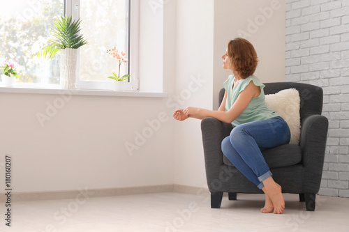 Young woman resting in armc...
