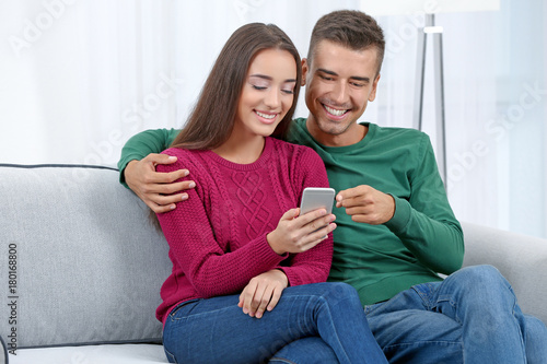 Young couple with phone on ...