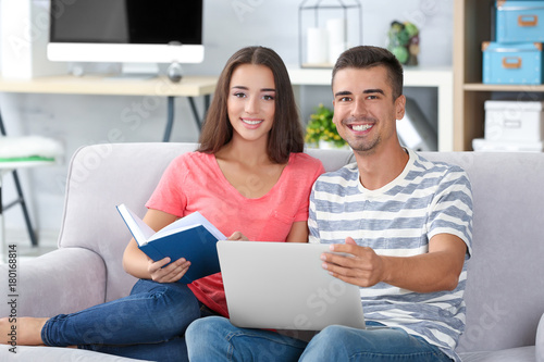 Young couple on sofa at home