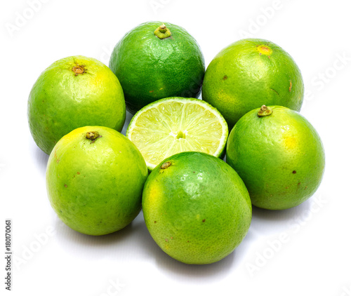 Group of whole lime in the shape of flower and half in the centre isolated on white background.