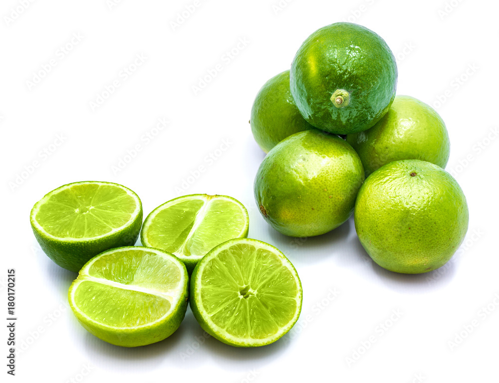 Group of whole and lime halves isolated on white studio background. Group of whole and lime halves isolated on white studio background.