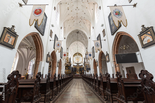 Aisle and pews at the empty Oliwa Archcathedral in Gdansk  Poland.