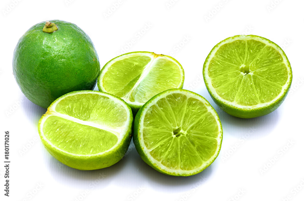 Group of sliced lime halves and one whole isolated on white studio background. Group of sliced lime halves and one whole isolated on white studio background.