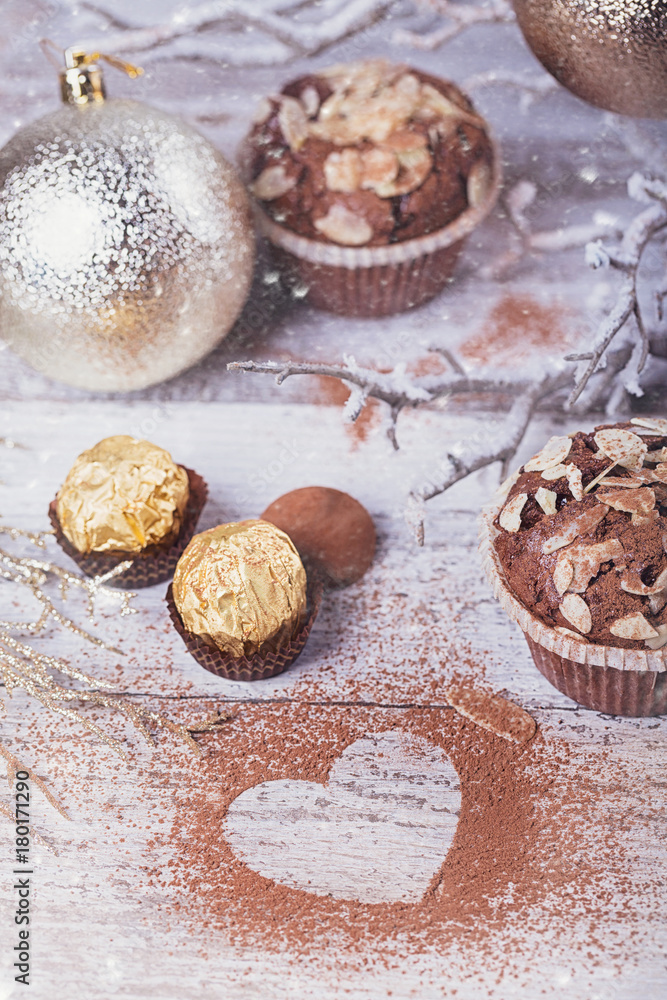 Tasty chocolate cupcake with sweets and winter decoration Tasty chocolate cupcake with sweets and winter decoration