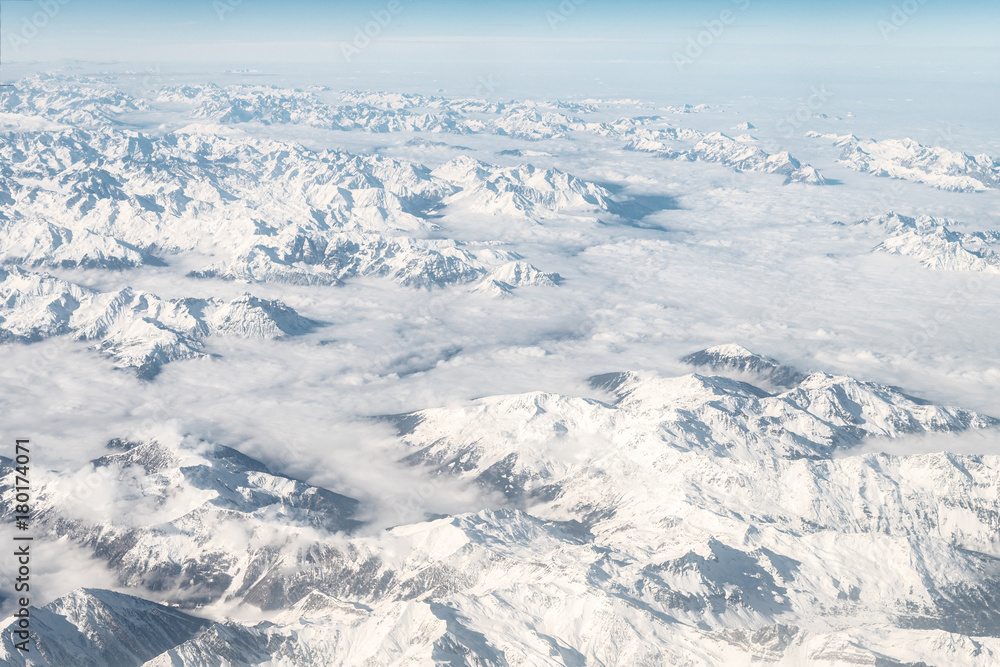 aerial view of snowy alps range, during winter season