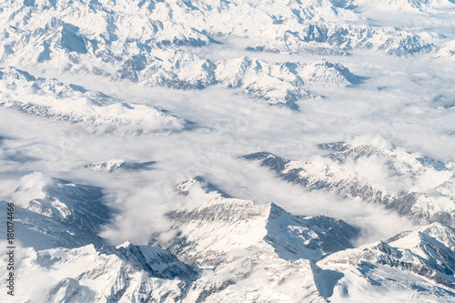 aerial view of snowy alps range on winter season