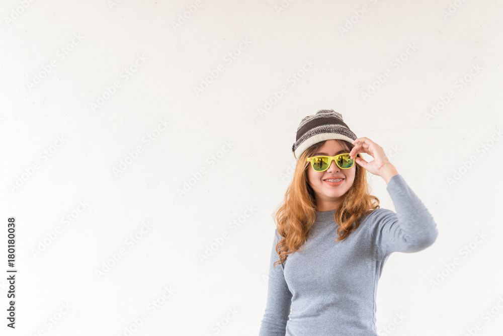 Portrait of hipster girl on white wall,lifestyle of modern teen,Cool hipster student woman wearing eyewear glasses Portrait of hipster girl on white wall,lifestyle of modern teen,Cool hipster student woman wearing eyewear glasses
