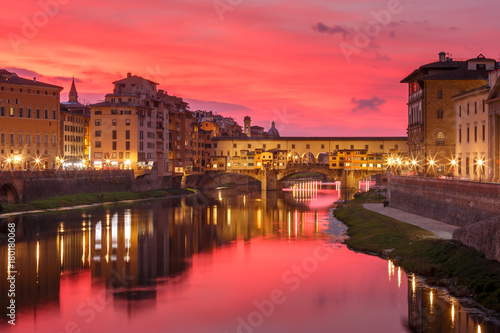 River Arno and famous bridge Ponte Vecchio at gorgeous sunset in Florence, Tuscany, Italy