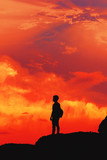 silhouette man in orange sky backgound