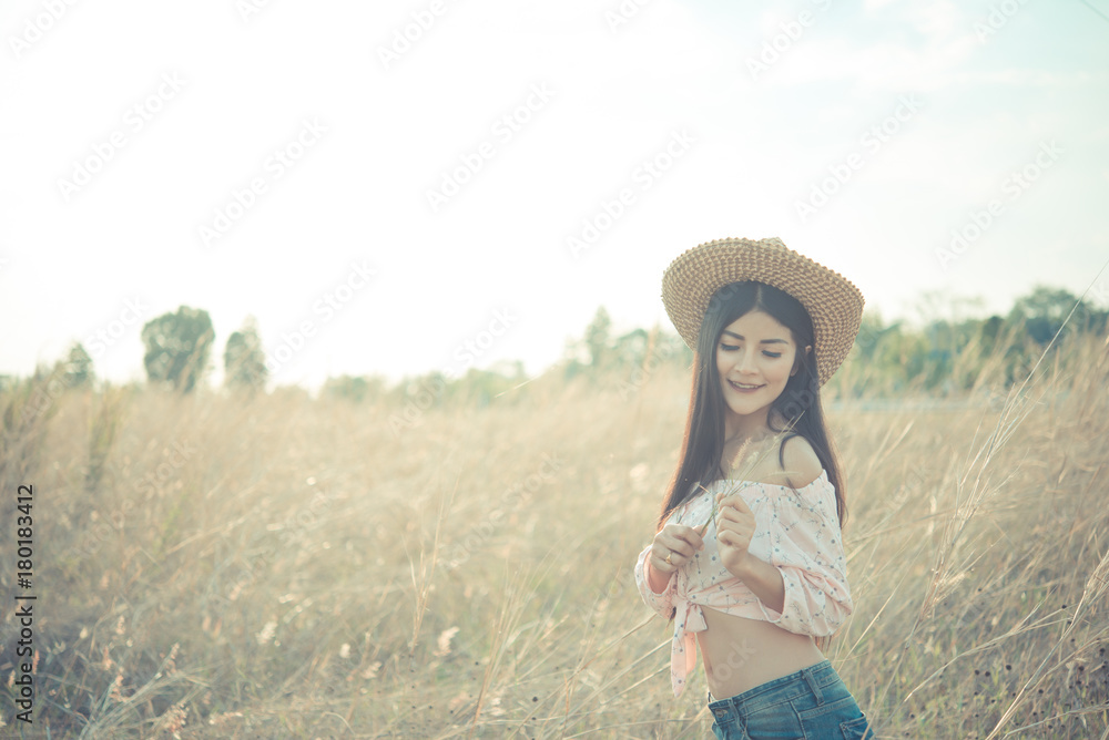 Close up of asian woman slim smiling in the field on sunset vintage style