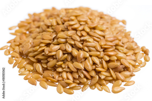 Golden Flax Seed. Pile of grains, isolated white background.