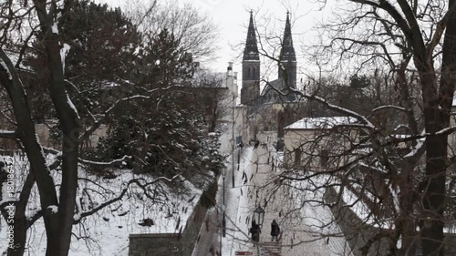 .Touristic view to street that leads to Basilica  of St Peter and St Paul in the Prague castle Visehrad. photo