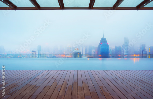 Photography Swimming pool on roof top with beautiful city skyline view,early morning with mist ,  kuala lumpur malaysia