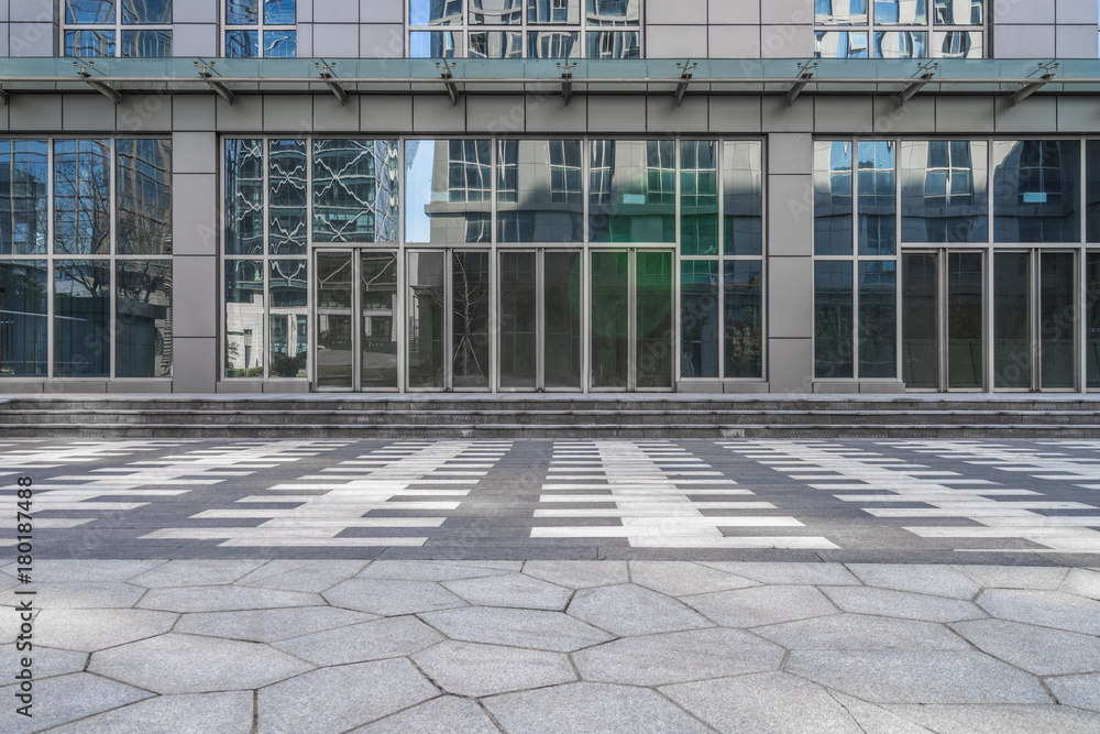 empty pavement front of the modern office entrance.