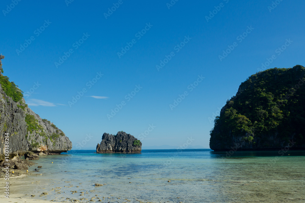 beautiful beach and sea with mountain background. Clear sea. Summer time. Relax on holidays. Travel beautiful beach and sea with mountain background. Clear sea. Summer time. Relax on holidays. Travel