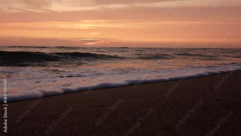 Sunset on the coast of the stormy sea Sunset on the coast of the stormy sea