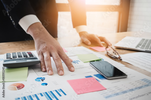 Young Business man working at office with laptop,smartphone mobi
