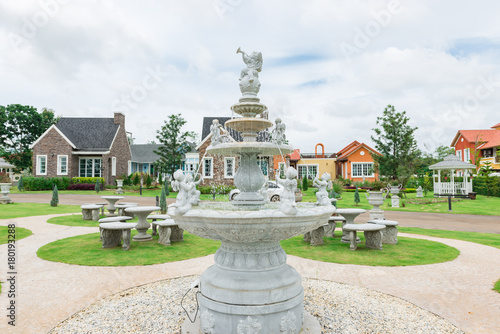 Fountain decorate cupid in the garden on home tuscany style background
