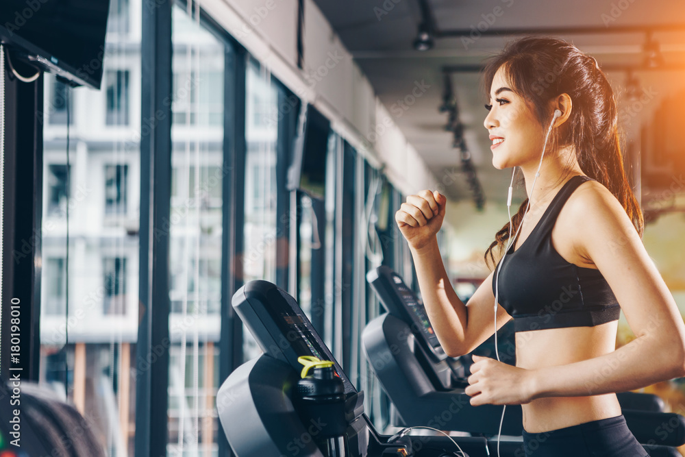 Asian woman exercising in the gym, Young woman workout in fitness for her healthy and office girl lifestyle. Asian woman exercising in the gym, Young woman workout in fitness for her healthy and office girl lifestyle.